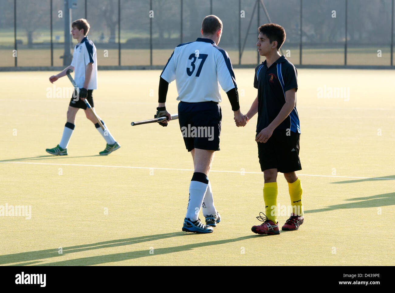 Men`s hockey at club level, players shaking hands after match. Stock Photo
